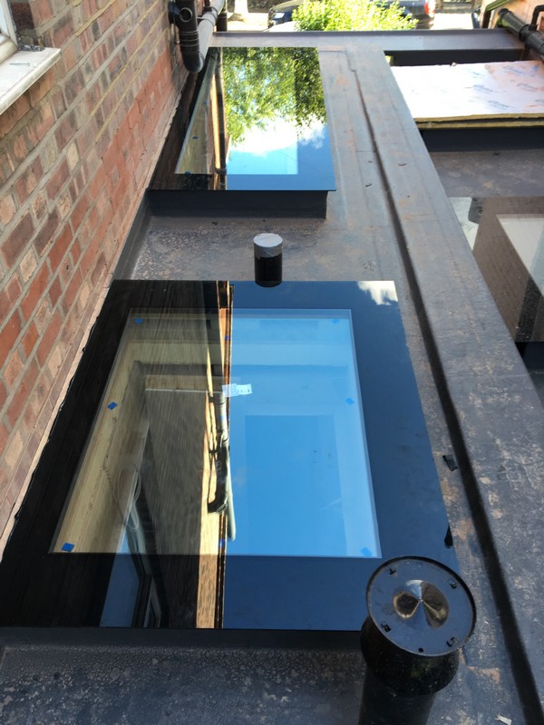 Multiple flat roof skylights on extension in Lower Edmonton